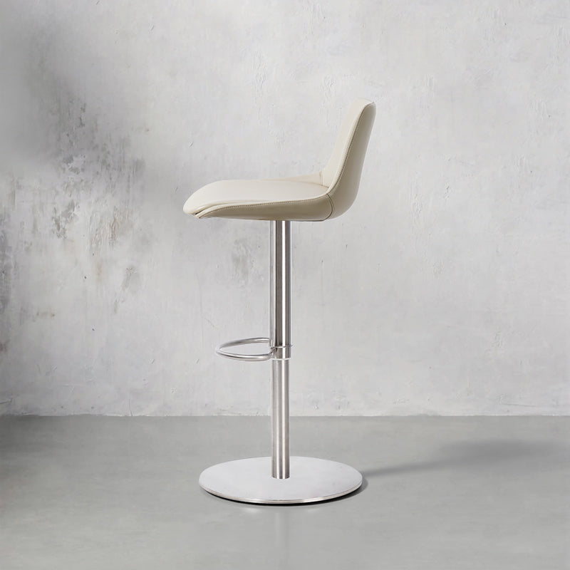 Heduedmobel HD-7603 Meirou PU leather bar chair with sleek design and sturdy metal frame, shown from a side angle.