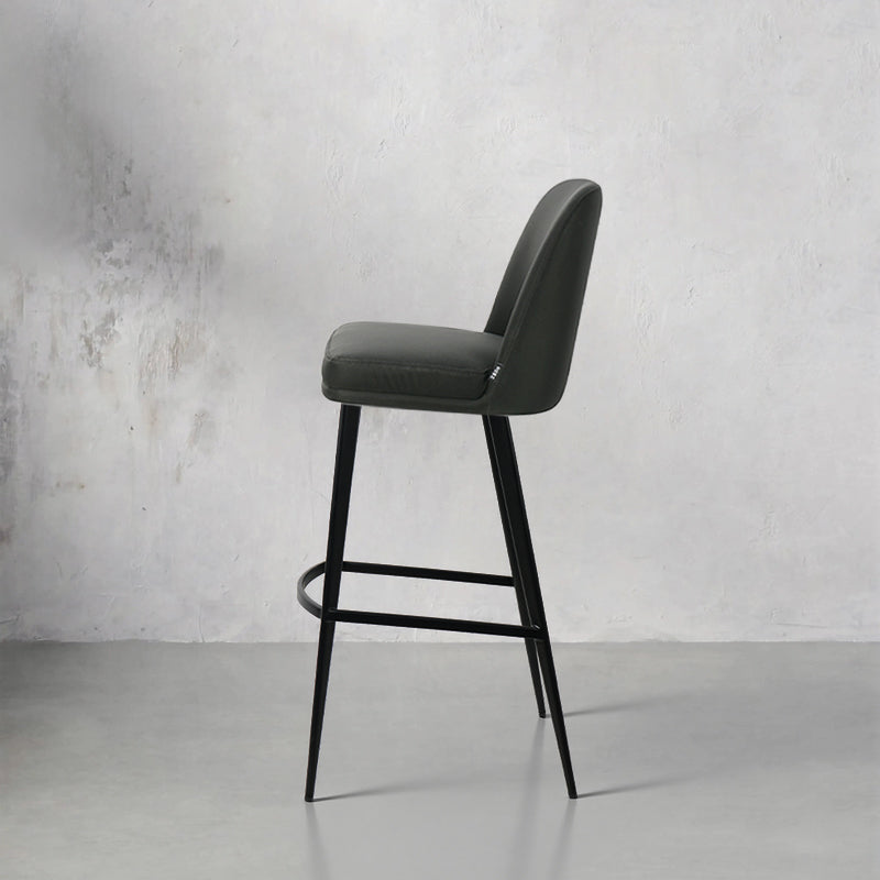 Heduedmobel HD-7516 Meimei PU leather bar chair with modern design and cushioned seat, shown from a side angle.